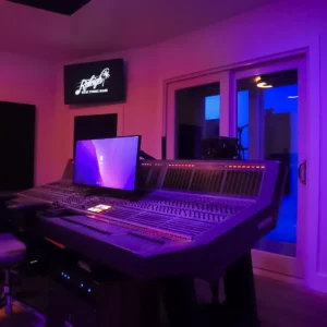 Studio A Magic City Room with a screen and controls in middle