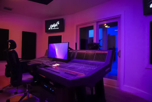 Studio A Magic City Room with a screen and controls in middle