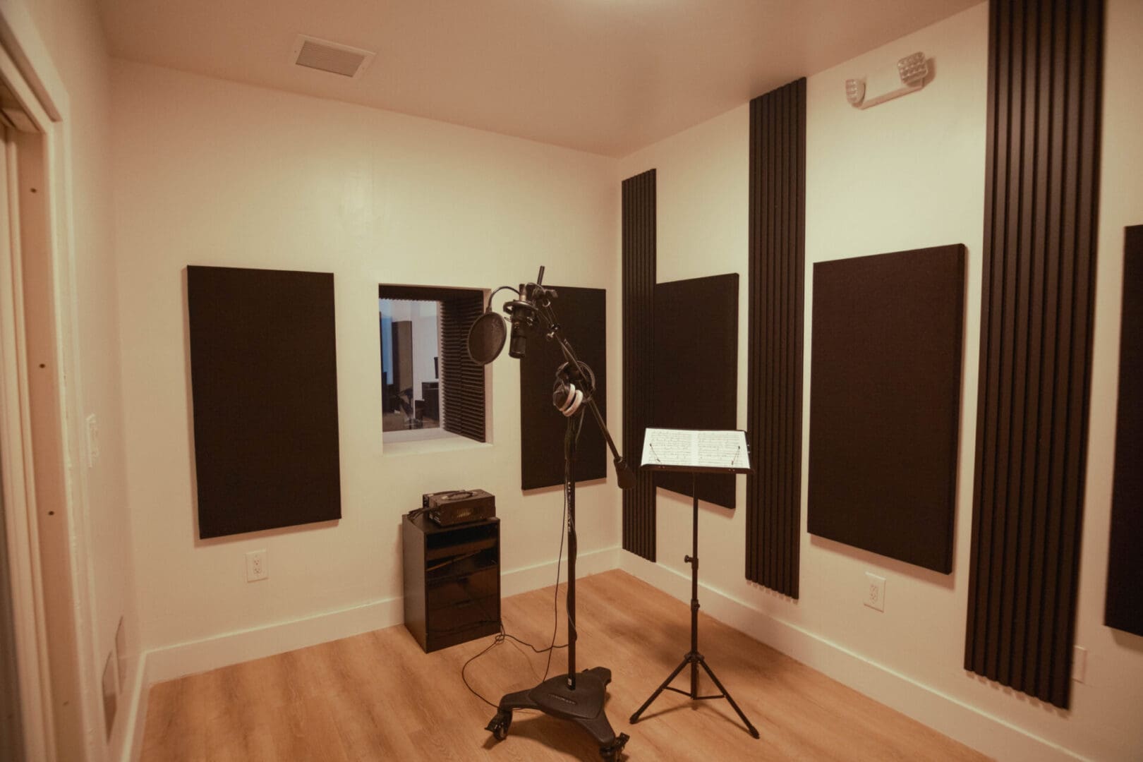 A room with many speakers and a microphone.