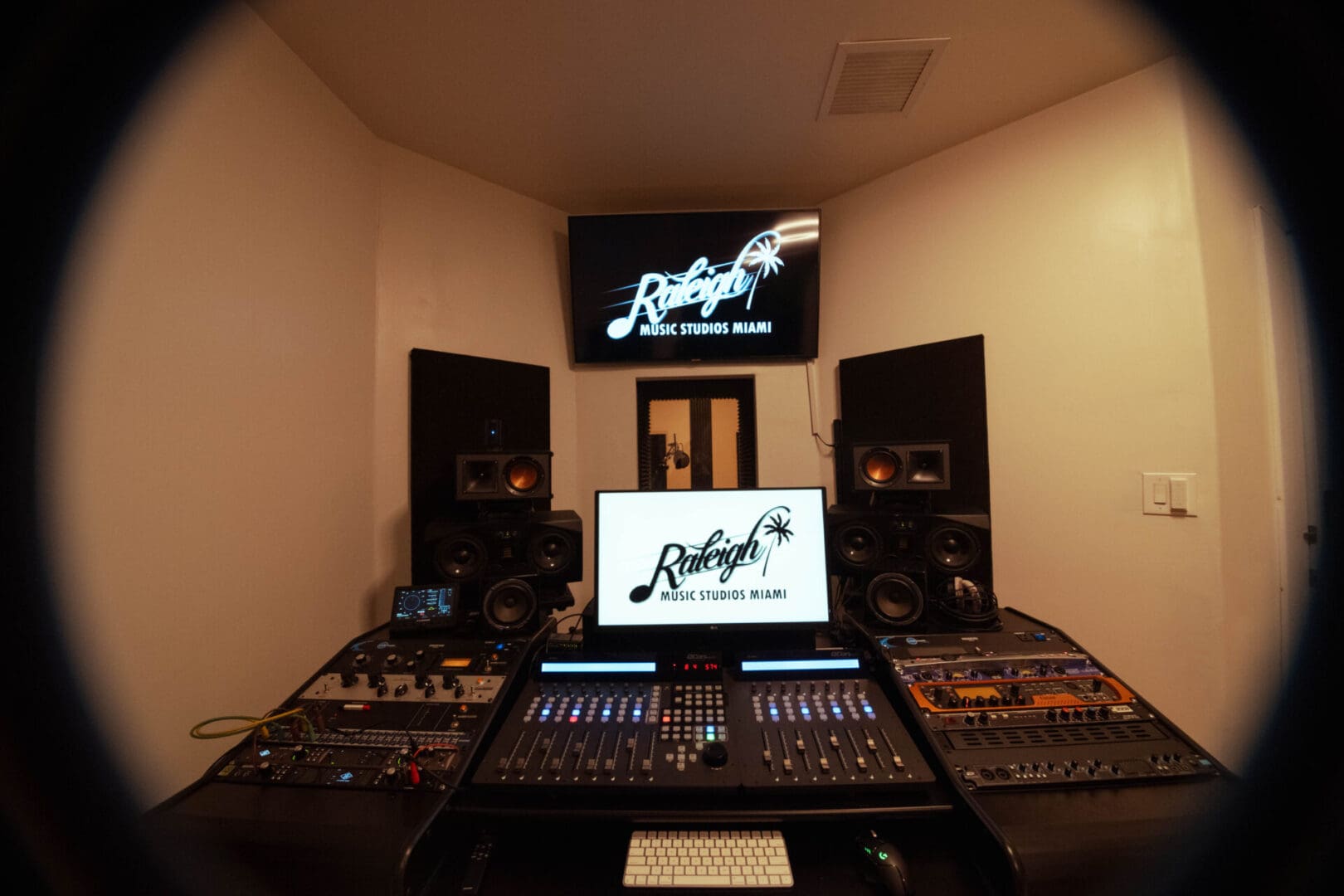 A large room with many speakers and a laptop