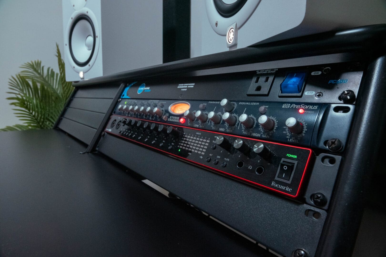 A black and red control panel sitting on top of a table.