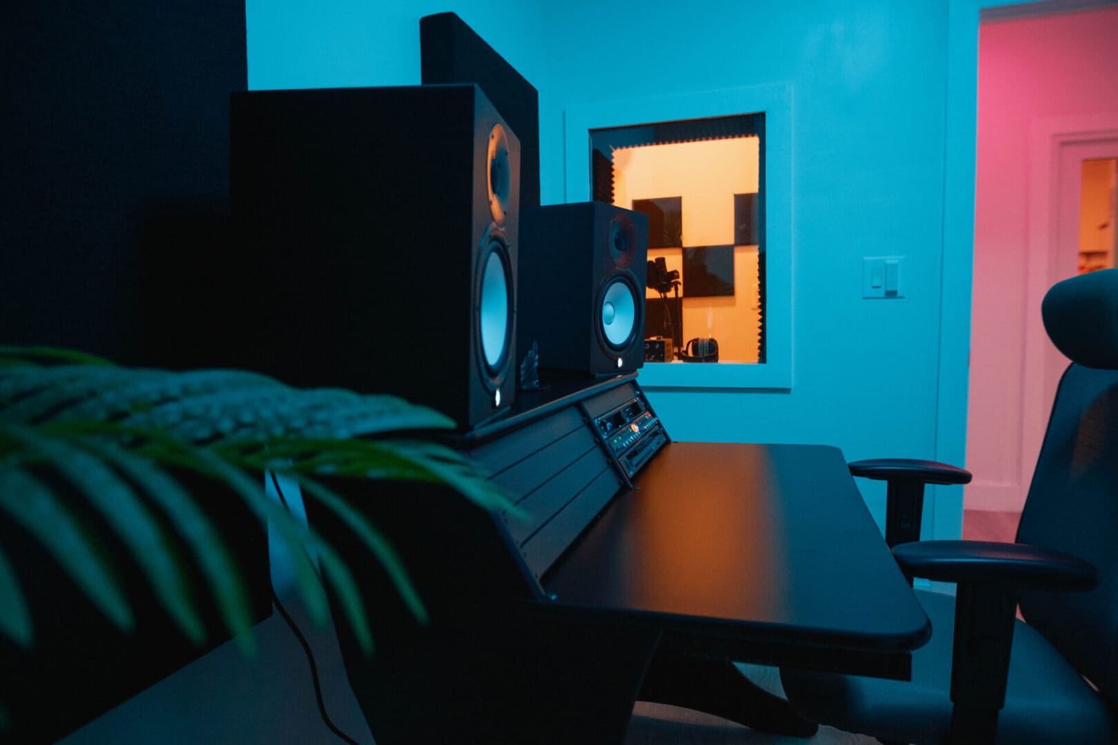 A room with two speakers and a table