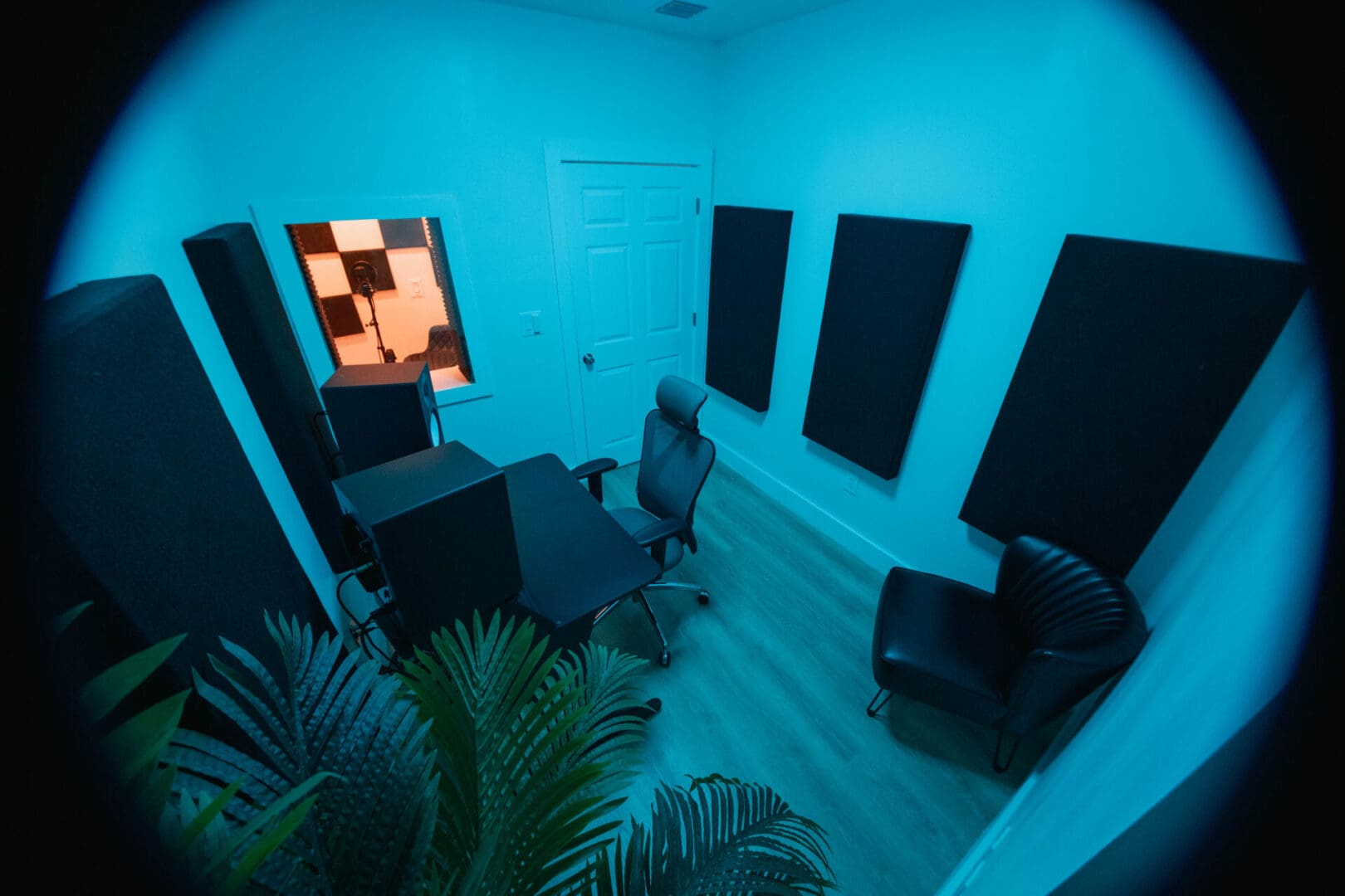 A room with many speakers and a window